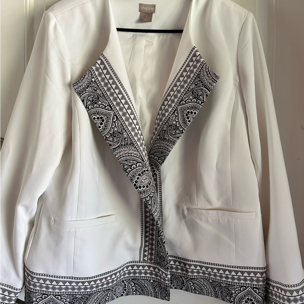 Chico jacket. White with black trim designs.
